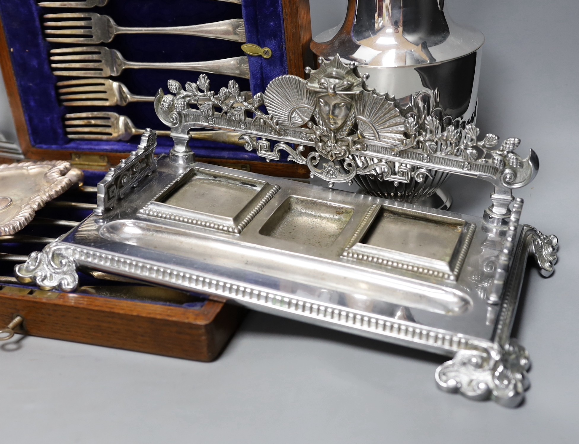 A quantity of various plated wares to include German candlesticks etc
